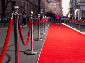 red carpet lined up outside a large building